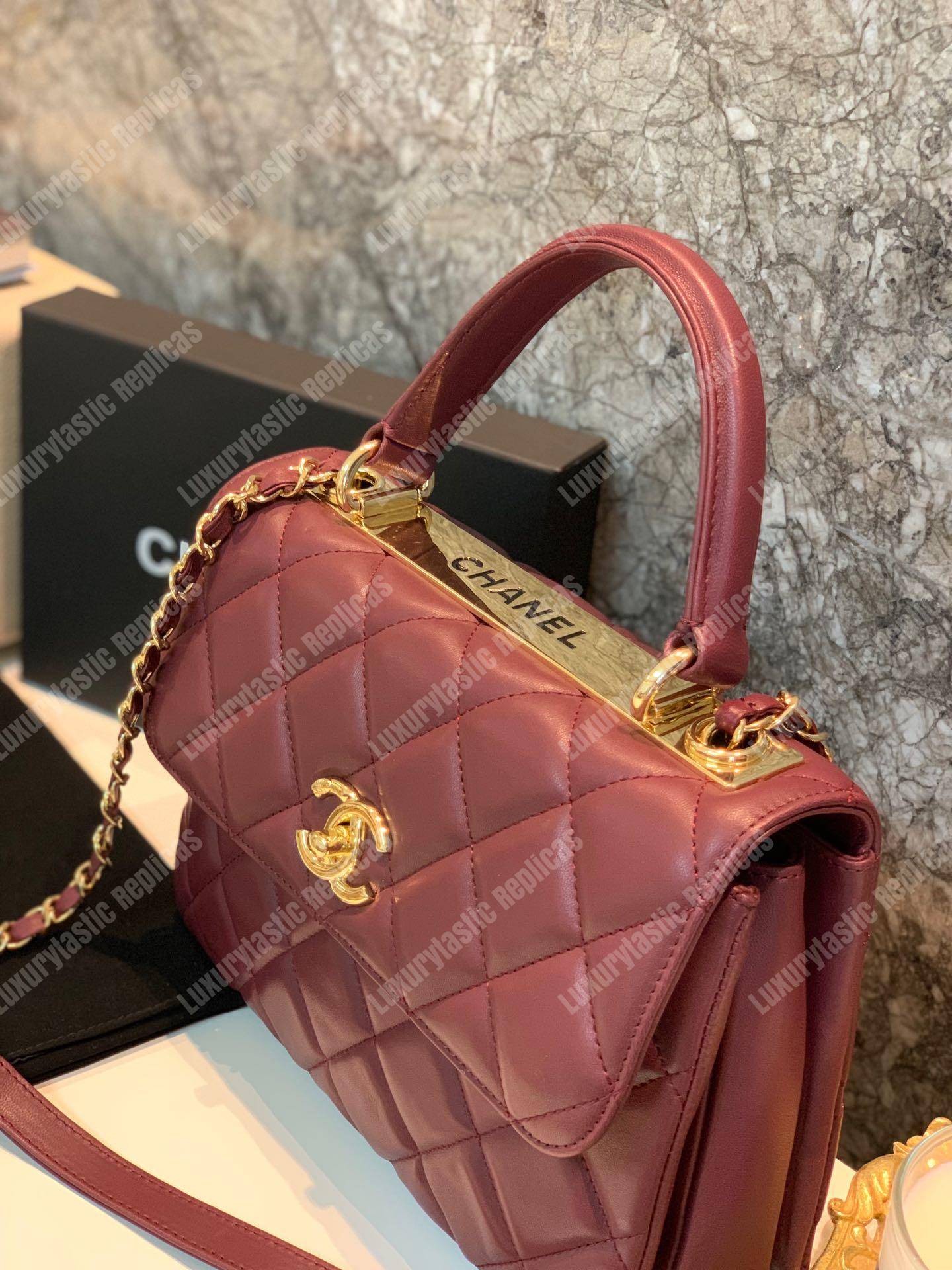 Ch*el small flap bag with top handle burgundy-gold