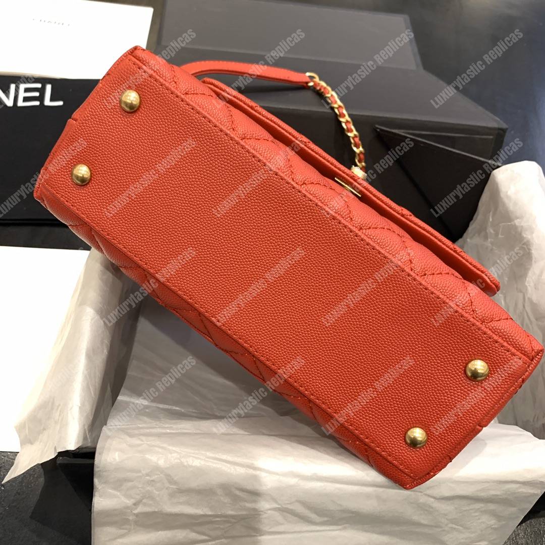 Ch*el flap bag with top handle orange