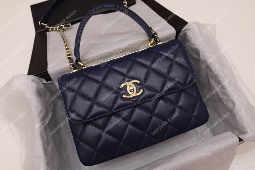 Ch*el small flap bag with top handle navy blue-gold
