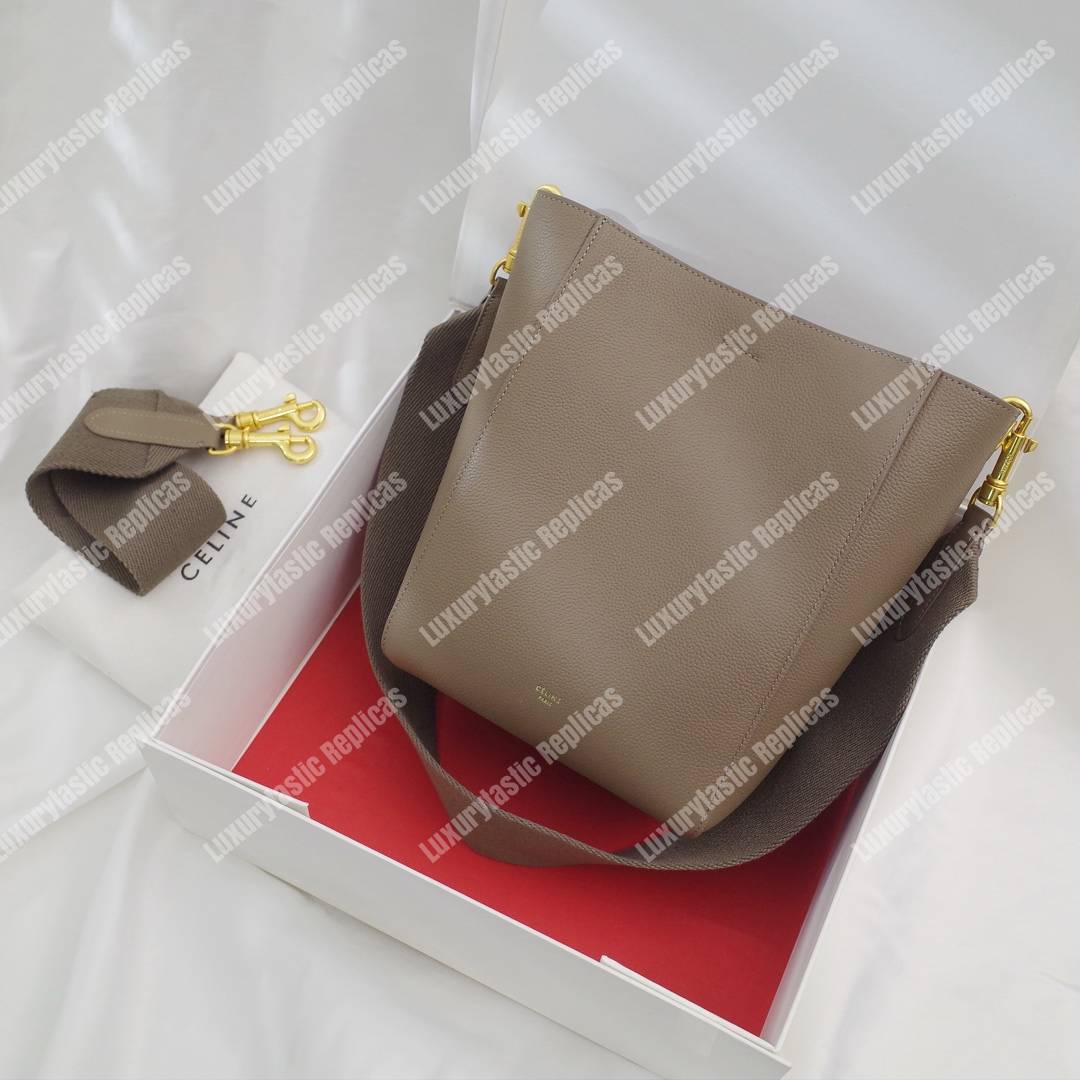 Ce**e sangle small bucket bag in soft grained calfskin taupe