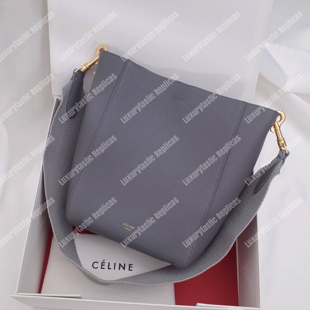 Ce**e sangle small bucket bag in soft grained calfskin grey