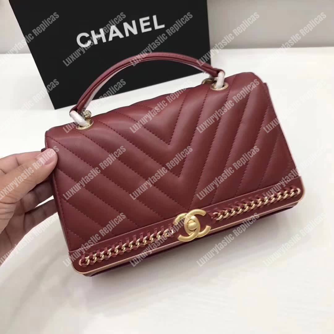 Ch*el chevron stitched chain top handle flap bag red