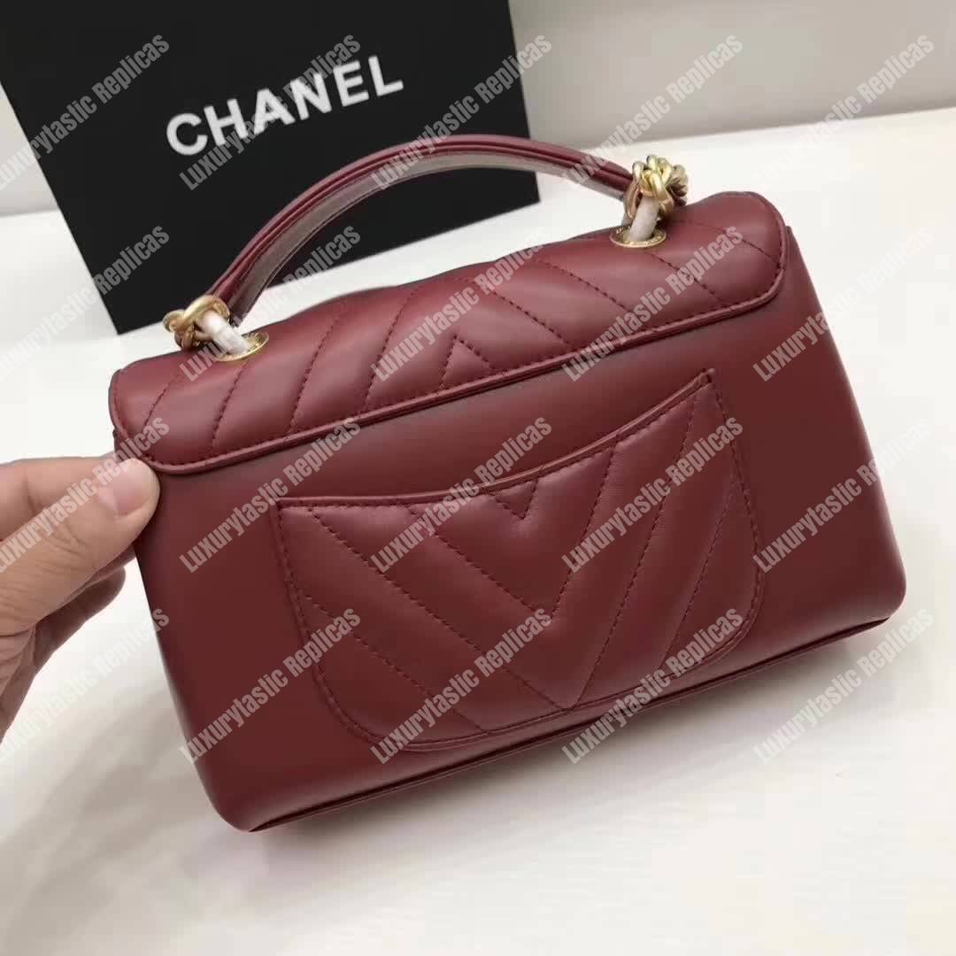 Ch*el chevron stitched chain top handle flap bag red