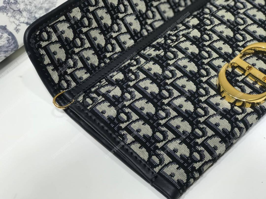 30 Montaigne Jacquard Canvas Clutch Bag Blue