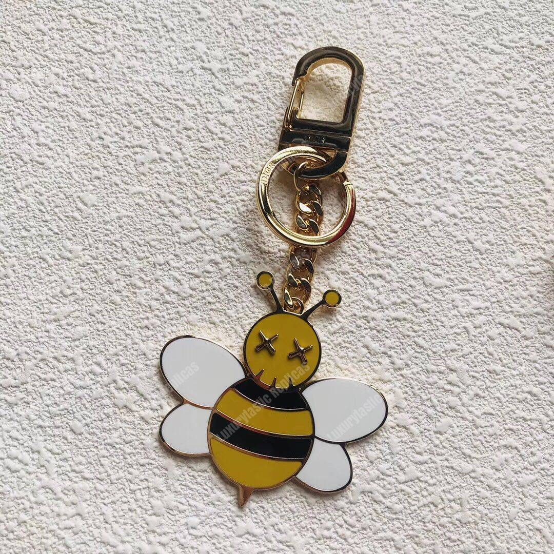 D*or x kaws bee key ring in brass & resin