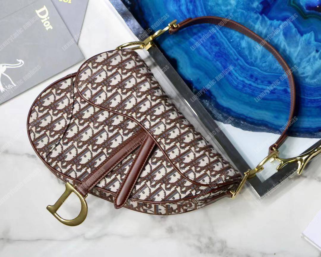 D*or burgundy oblique saddle bag