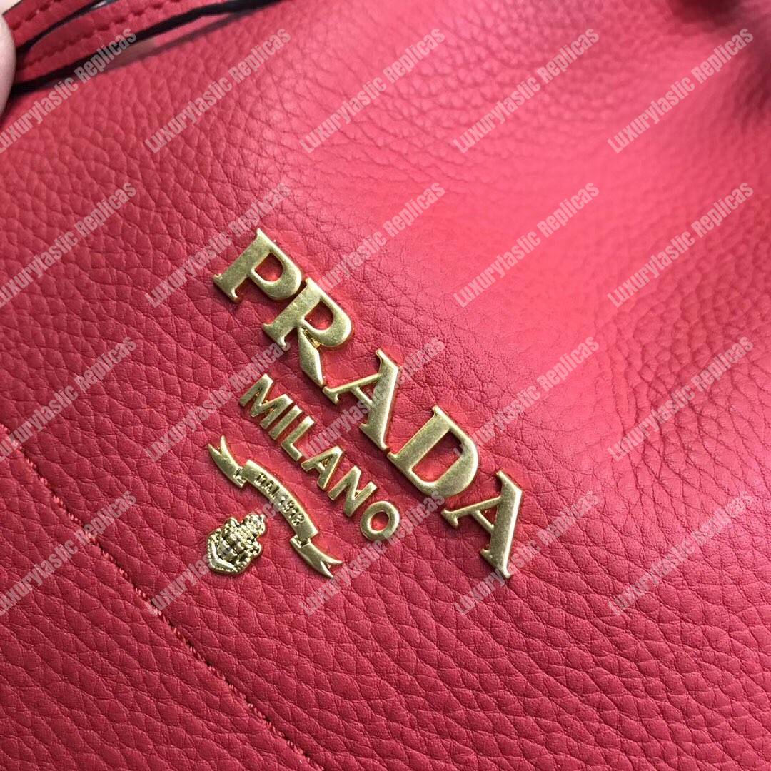 Pra*a leather bucket bag red