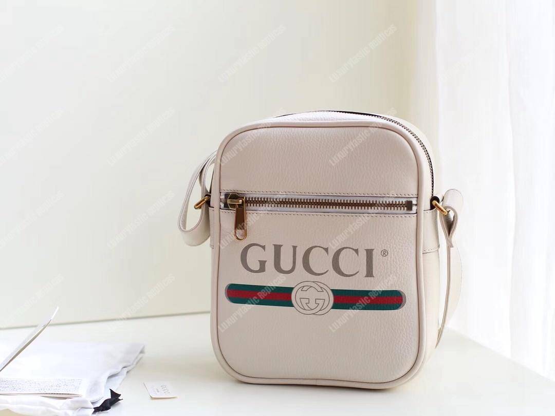 G*u*i print messenger bag white leather