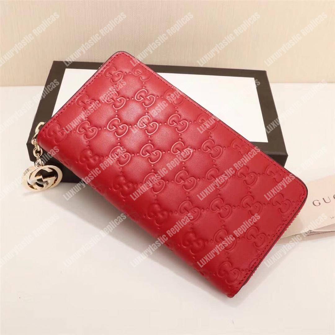 G*u*i icon G*u*i signature zip around wallet hibiscus red