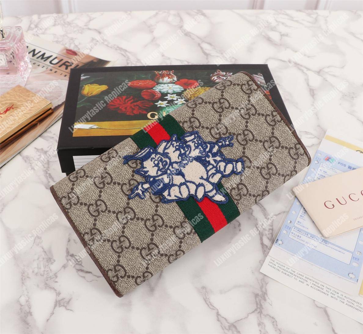G*u*i gg continental wallet with three little pigs