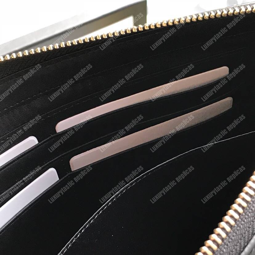 G*u*i leather pouch with G*u*i logo