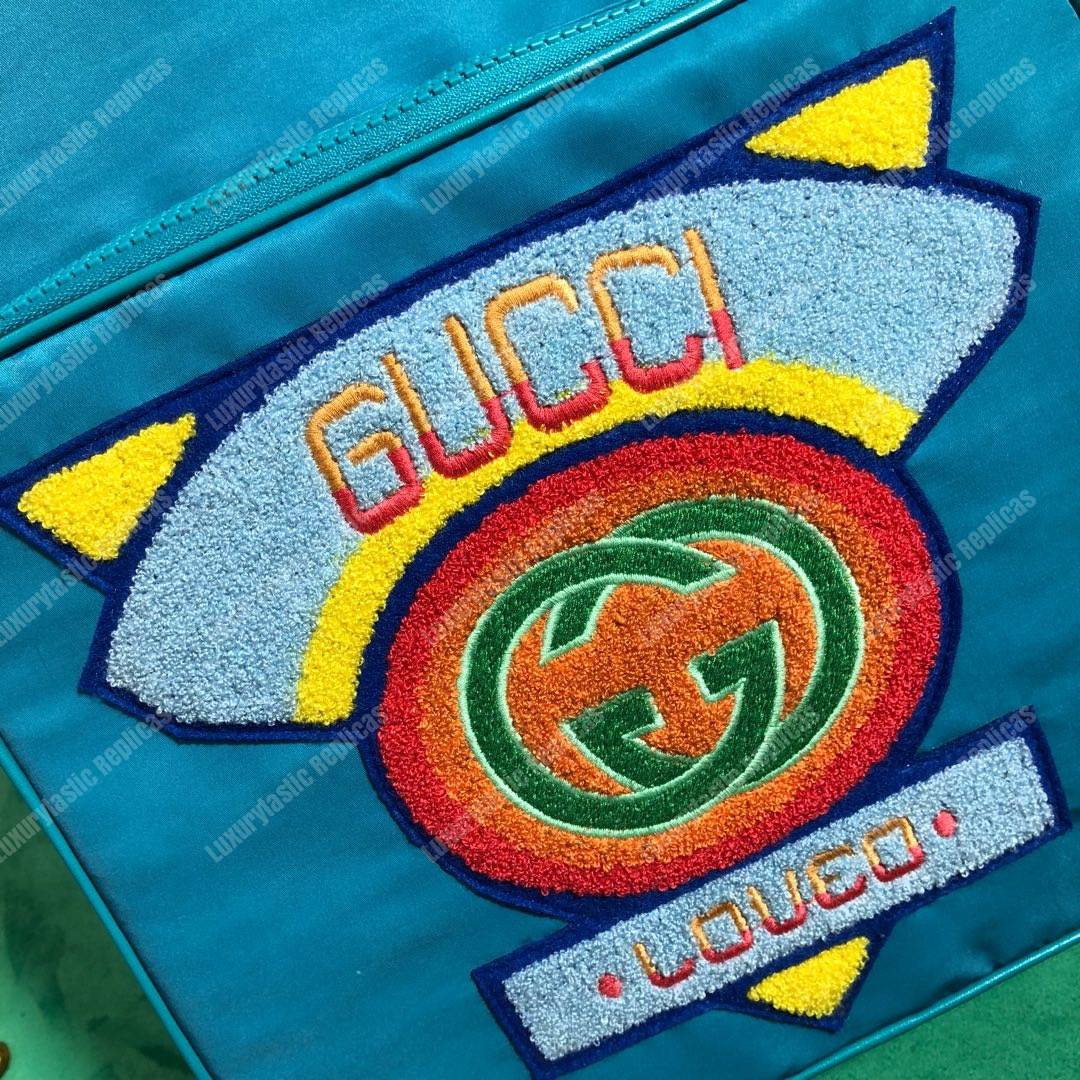 G*u*i medium backpack with G*u*i ’80s patch light blue