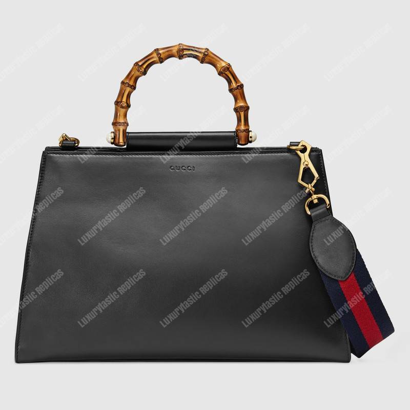 G*u*i nymphaea leather top handle bag