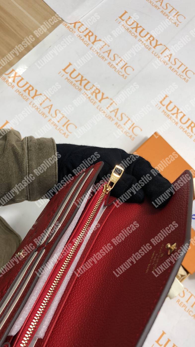 LV Sarah Wallet Monogram Empreinte Leather Scarlet