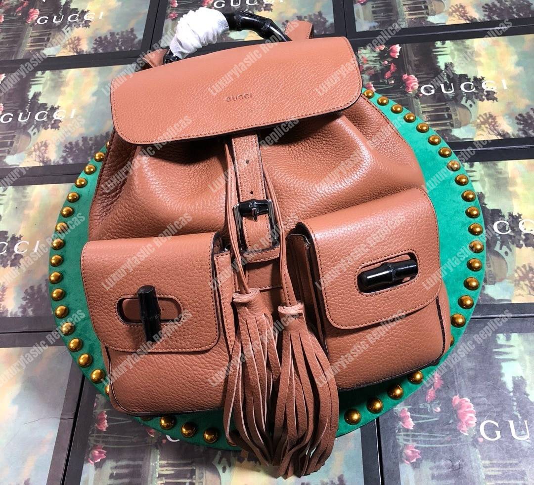 G*u*i leather bamboo tassel backpack light brown
