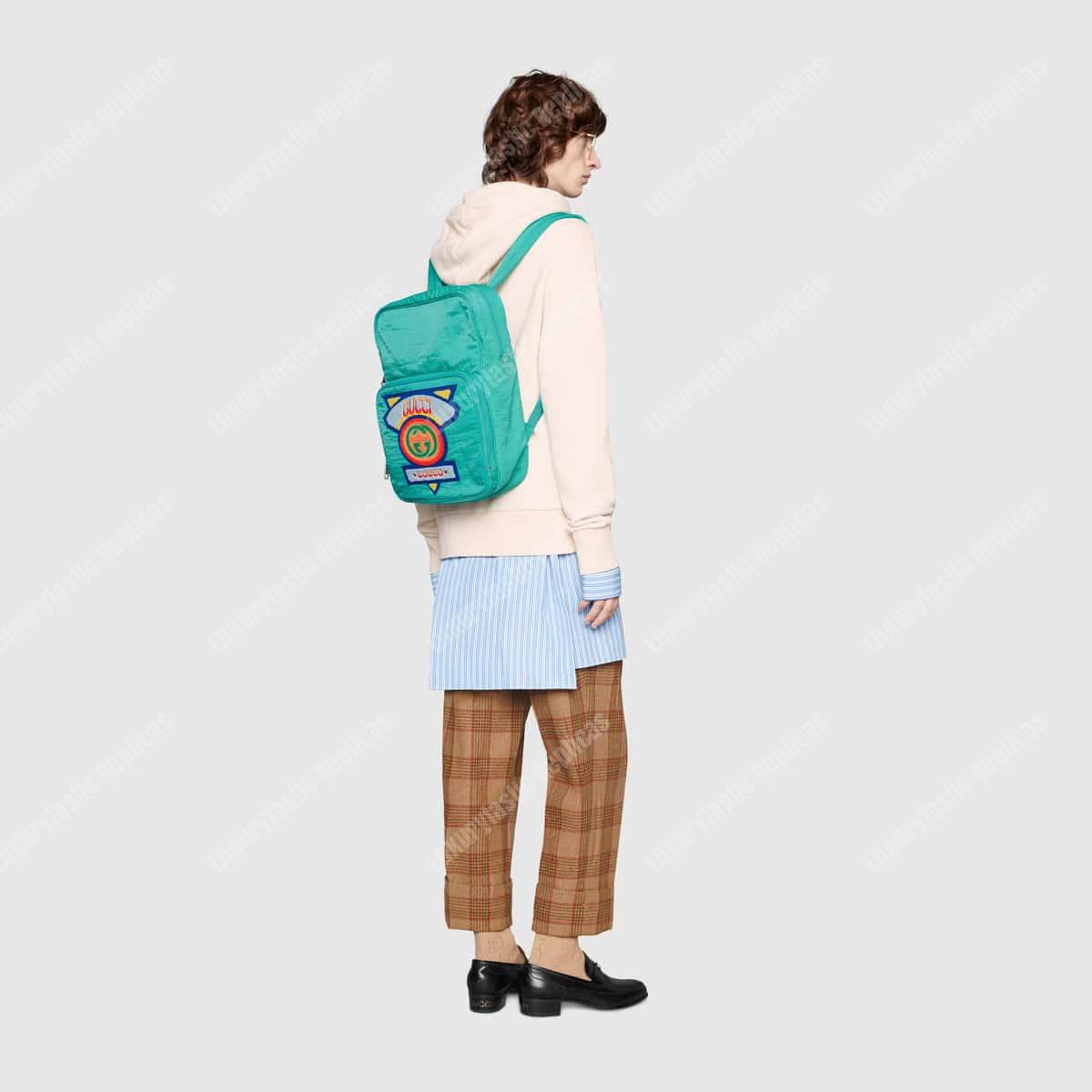 G*u*i medium backpack with G*u*i ’80s patch light blue