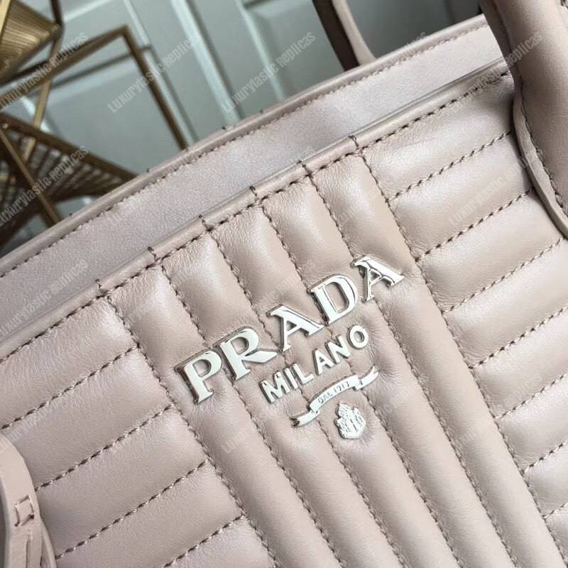 Pra*a diagramme leather handbag powder pink