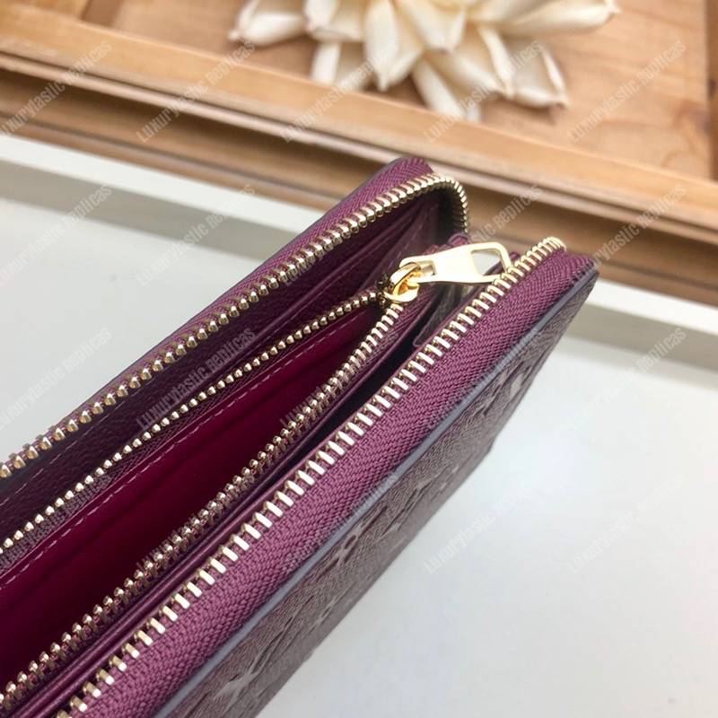 LV Clémence Wallet Monogram Empreinte Leather Raisin