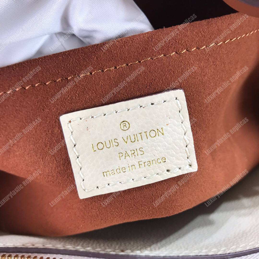 LV Montaigne MM Monogram Empreinte leather Creme