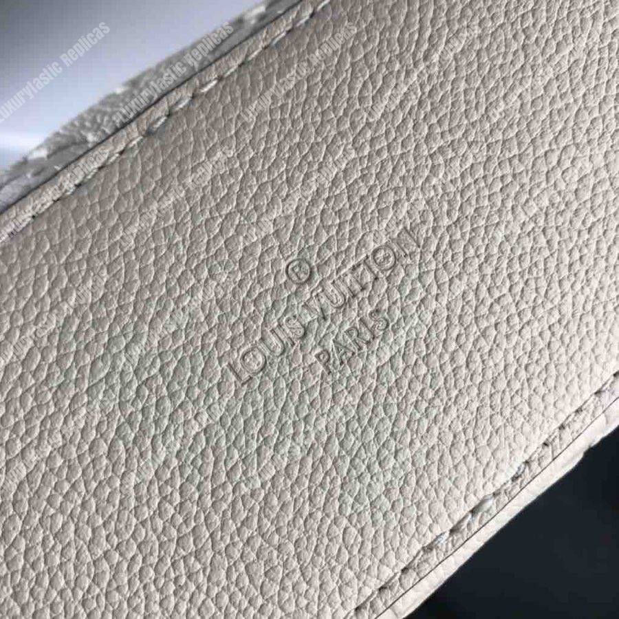 LV Saintonge Monogram Empreinte Leather Creme Caramel