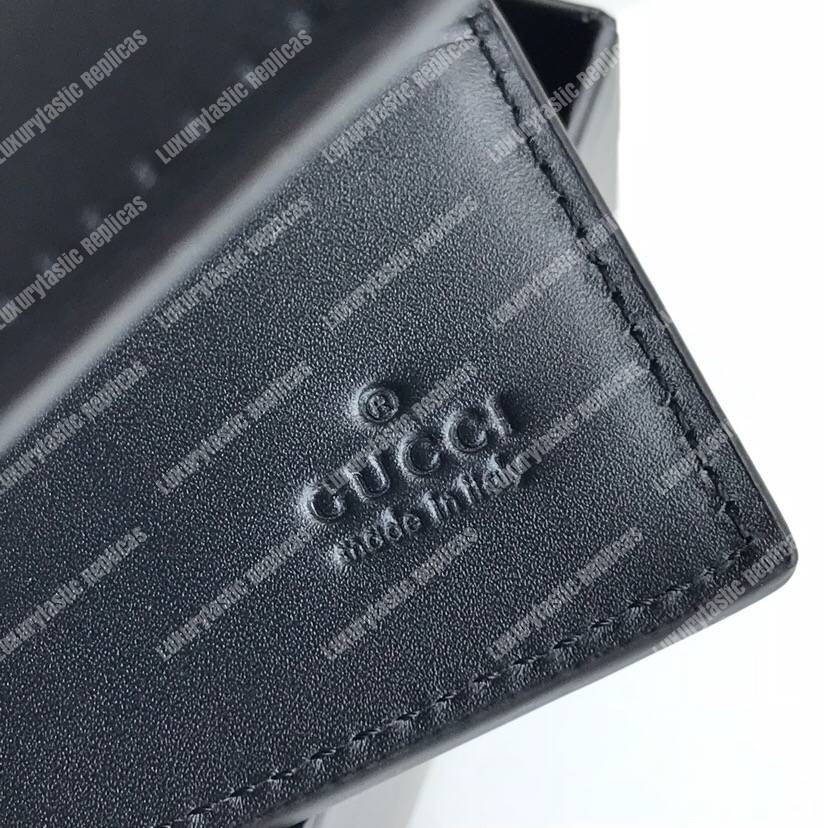G*u*i leather wallet with G*u*i logo
