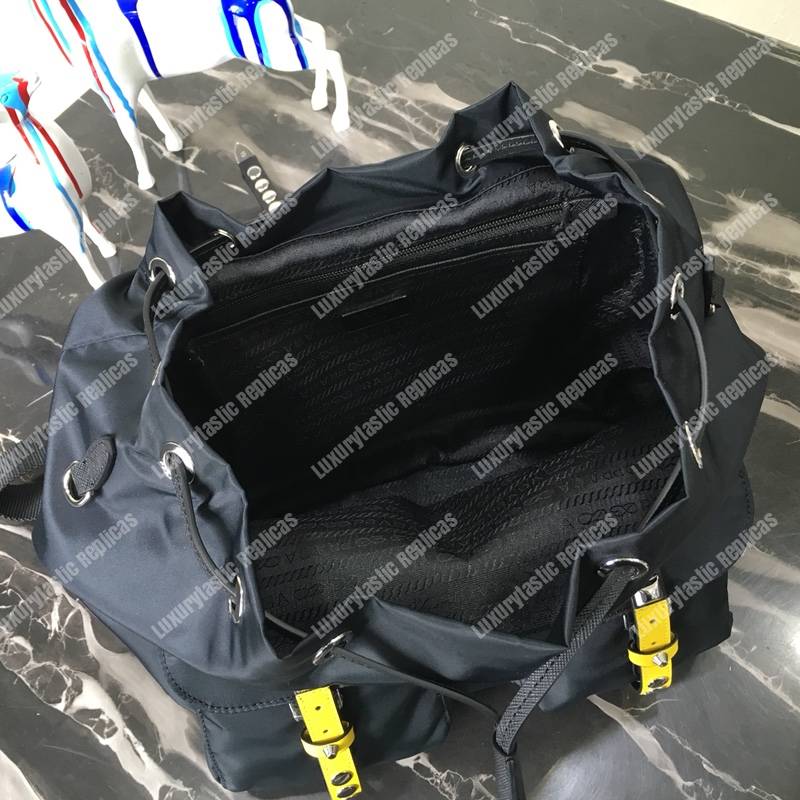 Pra*a black nylon backpack yellow