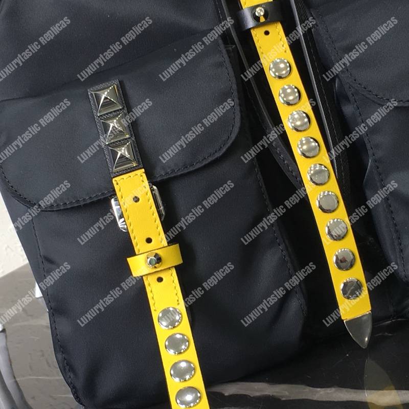 Pra*a black nylon backpack yellow