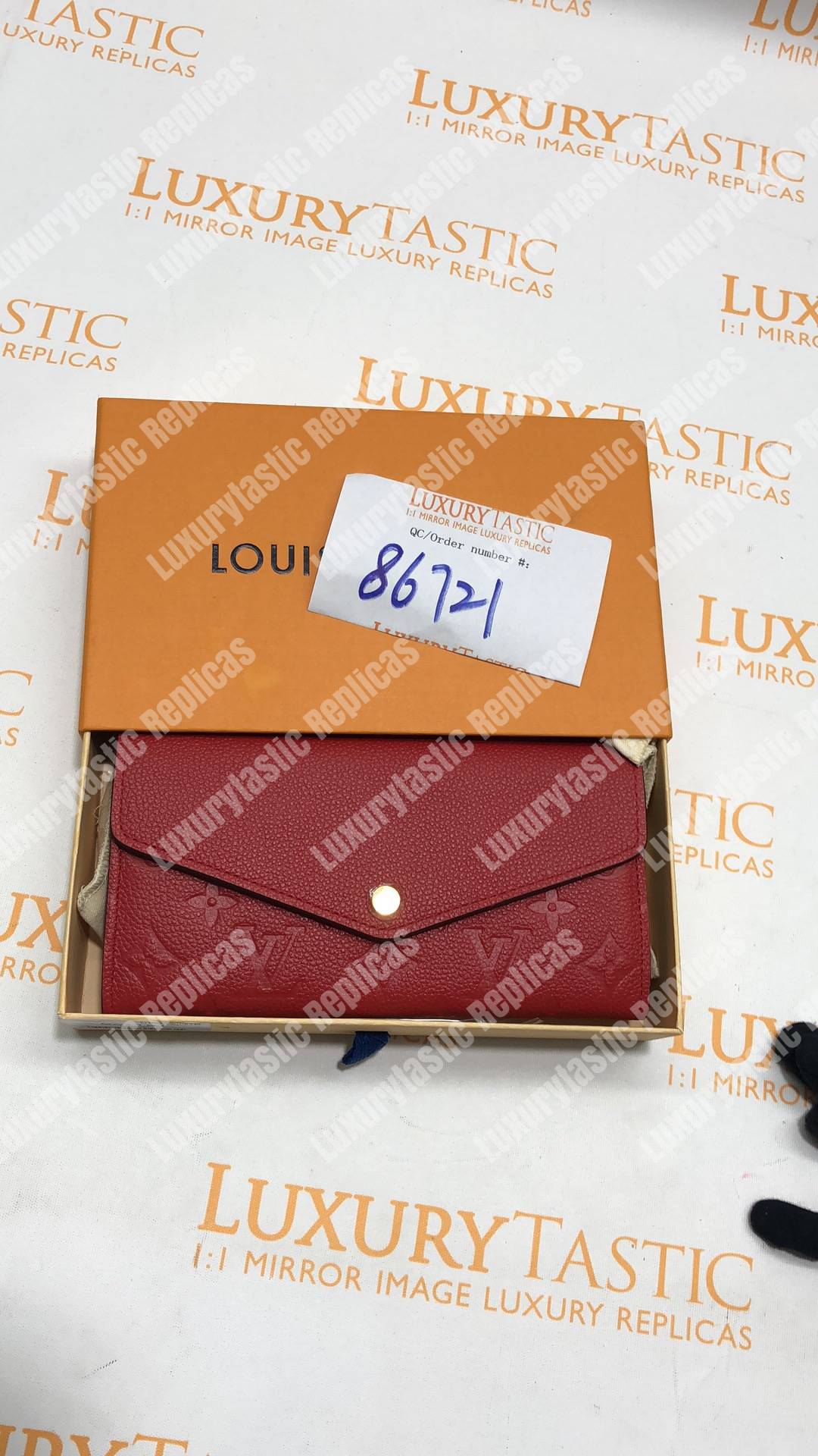 LV Sarah Wallet Monogram Empreinte Leather Scarlet