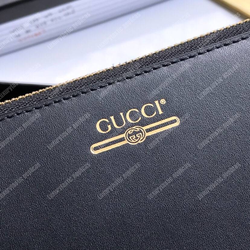 G*u*i leather pouch with G*u*i logo