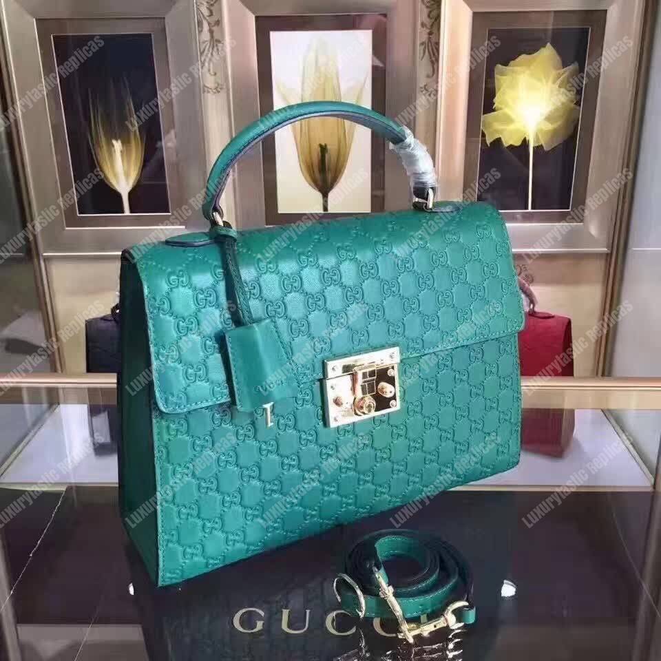 G*u*i padlock medium signature top handle bag emerald green