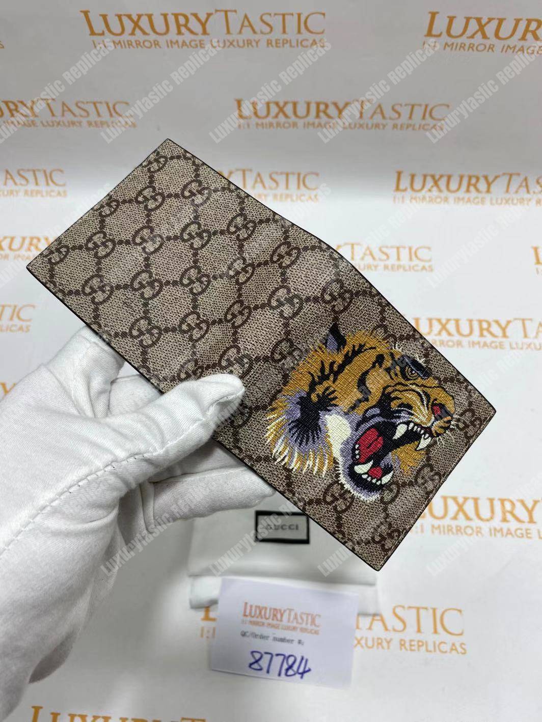 G*u*i tiger print gg sup*e wallet