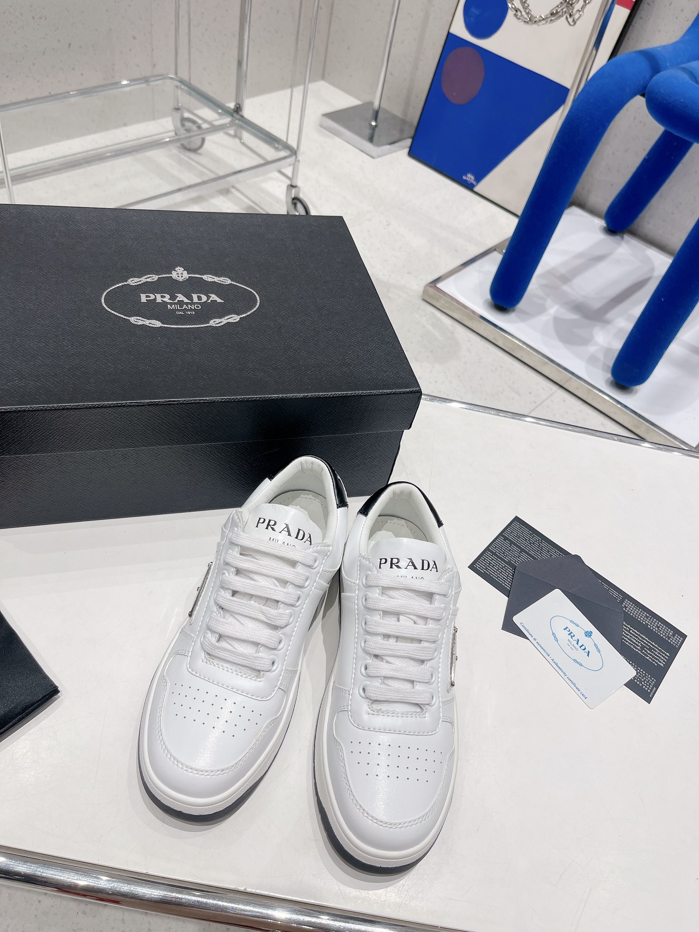 Pra*a downtown perforated leather sneakers white/black 1e792m